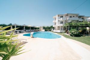 an image of a swimming pool in front of a building at Villa Antonio in Ulcinj