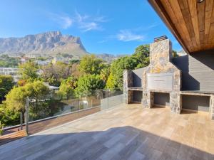 a view of the mountains from the balcony of a house at Lily of the Valley - Higgovale in Cape Town