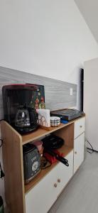 a wooden shelf with a coffee maker on it at Casa Las Luces in Nanacamilpa +7 photos