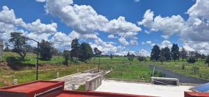 a skate park on a field with clouds in the sky at Casa Las Luces in Nanacamilpa