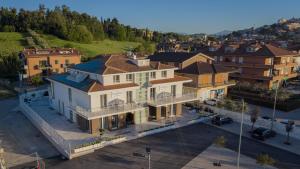 an overhead view of a large house in a city at TubHotel in Grottazzolina