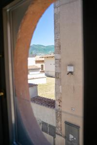 a view from a window of a building at 99 Rooms in LʼAquila +3 photos