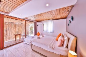 a bedroom with a bed and a large window at DuruPduru Kaş in Kaş