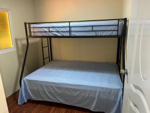a bedroom with a bunk bed in a room at Villa Clarice in Bonao +21 photos