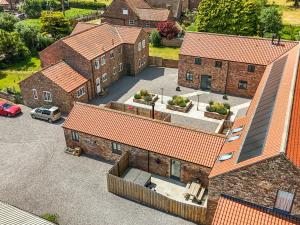 an aerial view of a house with a parking lot at The Stables in Thirsk