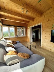 a large couch in a room with wooden walls at Ferienhaus Kühlwein in Bad Goisern