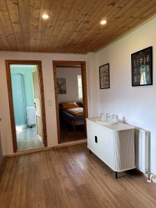a living room with a table and a bedroom at Ferienhaus Kühlwein in Bad Goisern +46 photos