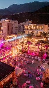 a group of umbrellas on a beach at night at Don Mare in Dhërmi