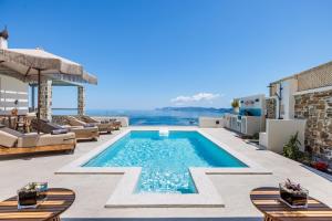 a swimming pool on the roof of a house with a view at Villa Aerys in Skopelos Town