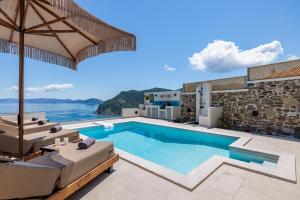 a villa with a swimming pool with a view at Villa Aerys in Skopelos Town