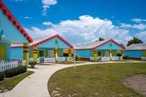 a row of colorful houses with a sidewalk at LEGOLAND® Florida Resort in Winter Haven
