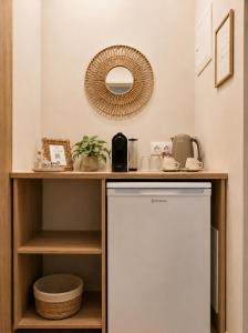 a kitchen with a white dishwasher and a counter at Lithos in Palaiochora