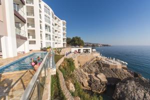 a view of the ocean from the balcony of a building at Nautilus Apartments in Dobra Voda