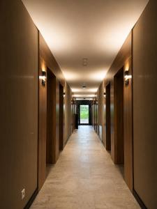 a hallway of a building with a long corridor at Hotel Evo in Witunia