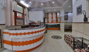 a lobby with a bar in the middle of a building at Family Group with Provide By PG Hotel Near New Delhi Railway station & Karol-Bagh in New Delhi