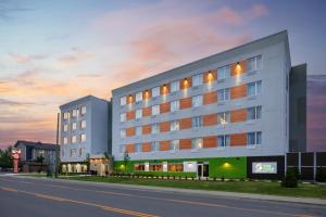 a large white building on the side of a street at Best Western Plus Kawartha Lakes Hotel & Suites in Lindsay