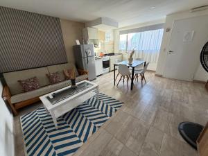 a living room with a couch and a table at San Francisco in Comodoro Rivadavia