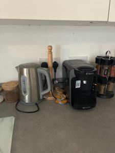 a kitchen counter with a coffee maker and a toaster at StaywithusHighbridge in Highbridge +12 photos