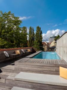 a swimming pool on the roof of a building at Vander Urbani Resort - a Member of Design Hotels in Ljubljana