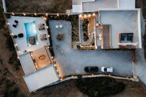 an aerial view of a house with lights on it at Stone Waves Αpartments & Villas in Agios Arsenios