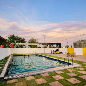 a swimming pool on the roof of a building at Kanha Green in Habībganj