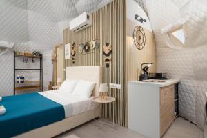 a small bedroom with a bed and a sink at Geo heaven glamp in Aïtánia +31 photos