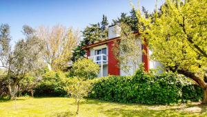 a red house with bushes in front of it at Coollyhouse Keklik tepe Urla in Urla