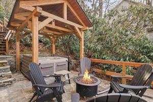 a patio with chairs and a fire pit and a pavilion at Misty Ridge Retreat in Blowing Rock