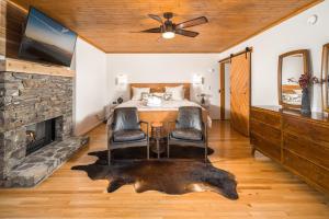 a bedroom with a bed and a fireplace at Misty Ridge Retreat in Blowing Rock +31 photos