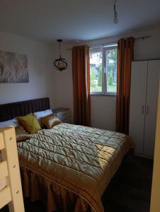 a bedroom with a bed and a window at A&H Pliva Retreat in Jajce