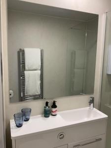 a bathroom with a sink and a large mirror at Gara-Ni Bed & Breakfast in Fort William +24 photos