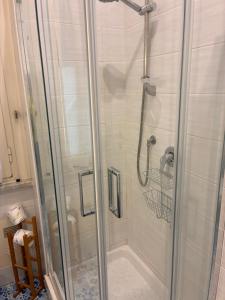 a shower with a glass door in a bathroom at Vic e Vicariell in Gaeta +25 photos