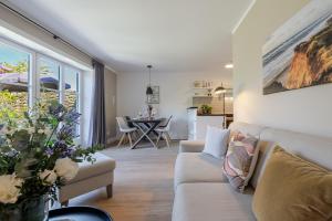 a living room with a couch and a table at Meersalz in Tinnum