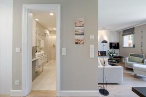 a living room with a sliding door leading into a living room at Meersalz in Tinnum +33 photos