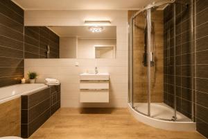 a bathroom with a shower and a sink at Apartament typu studio Doris 3 - 50m od plaży in Pobierowo +17 photos