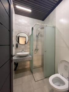 a bathroom with a sink and a shower and a toilet at Noragyugh Guest House in Yerevan +28 photos