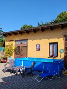 a house with a large pool in front of it at Dimora Gundin in Govone