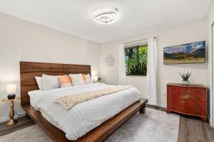 a bedroom with a large bed and a window at Backyard Hideaway with King Bed, Garage, Bicycles in Loveland