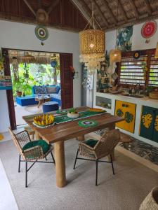 a kitchen with a table with bananas on it at Mandala House - Kite Village in Icaraí