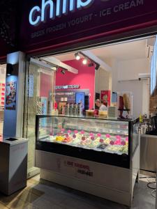 a ice cream shop with a display case of pastries at Boutique Sea & Garden in Vari