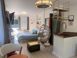 a room with a bed and a kitchen with a sink at Catskill Apartment, Little Love Bird #5 in Shandaken