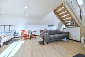 a living room with a couch and a bed and a table at Observer Ranch Campground & Learning Center in Penrose