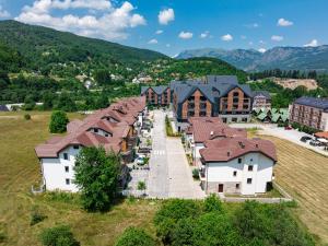 an aerial view of a village with houses at MonteBreza Spa Apartment Jacuzzi, Sauna & Free Parking in Kolašin