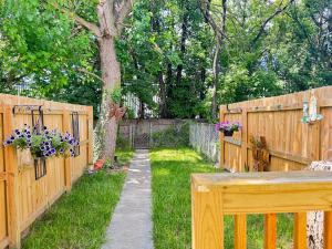 a garden with a fence and a tree at Providence & 18th in Chester