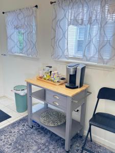 a desk with a coffee maker on top of it at Providence & 18th in Chester