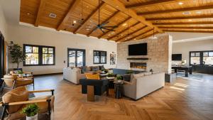 a living room with couches and a fireplace at Summerwell by AvantStay in La Quinta