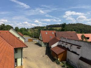 an overhead view of a group of buildings with red roofs at Hotel Atawa in Raby