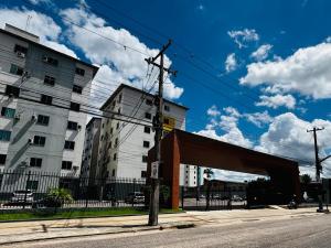 a view of a street with a building and awning at Apto c TV Streaming Ar Wifi e Piscina in Ananindeua
