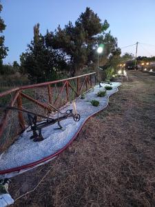 a surfboard laying on the ground next to a bridge at Αρχοντικο in Ayía Sofía +14 photos