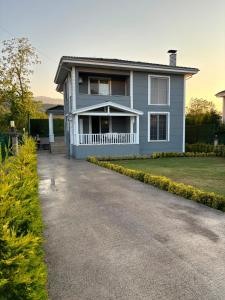 a house with a driveway in front of it at Antonelya Home in Sapanca